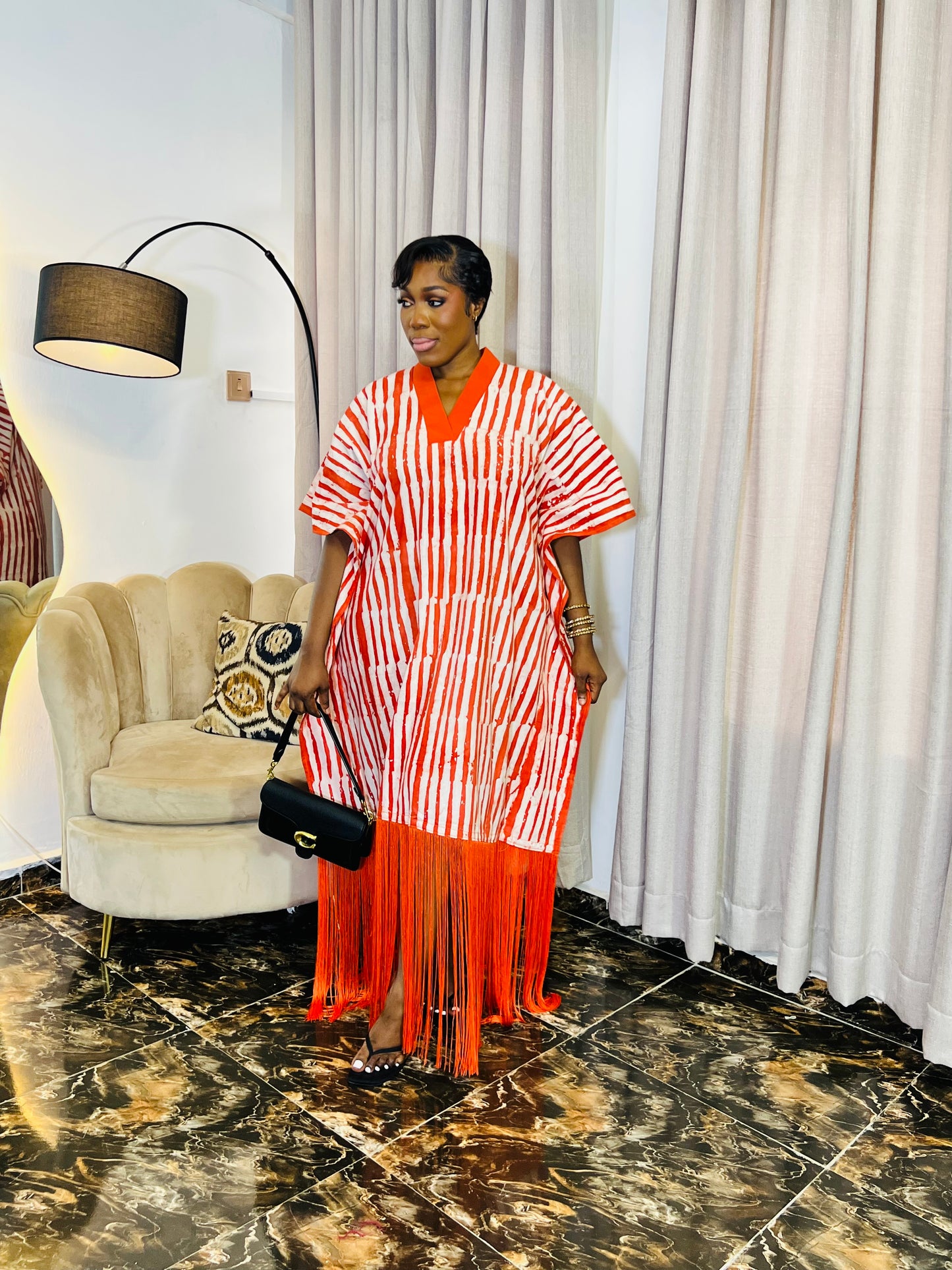 African woman wearing fringe bubu dress – hand-dyed tie-dye kaftan