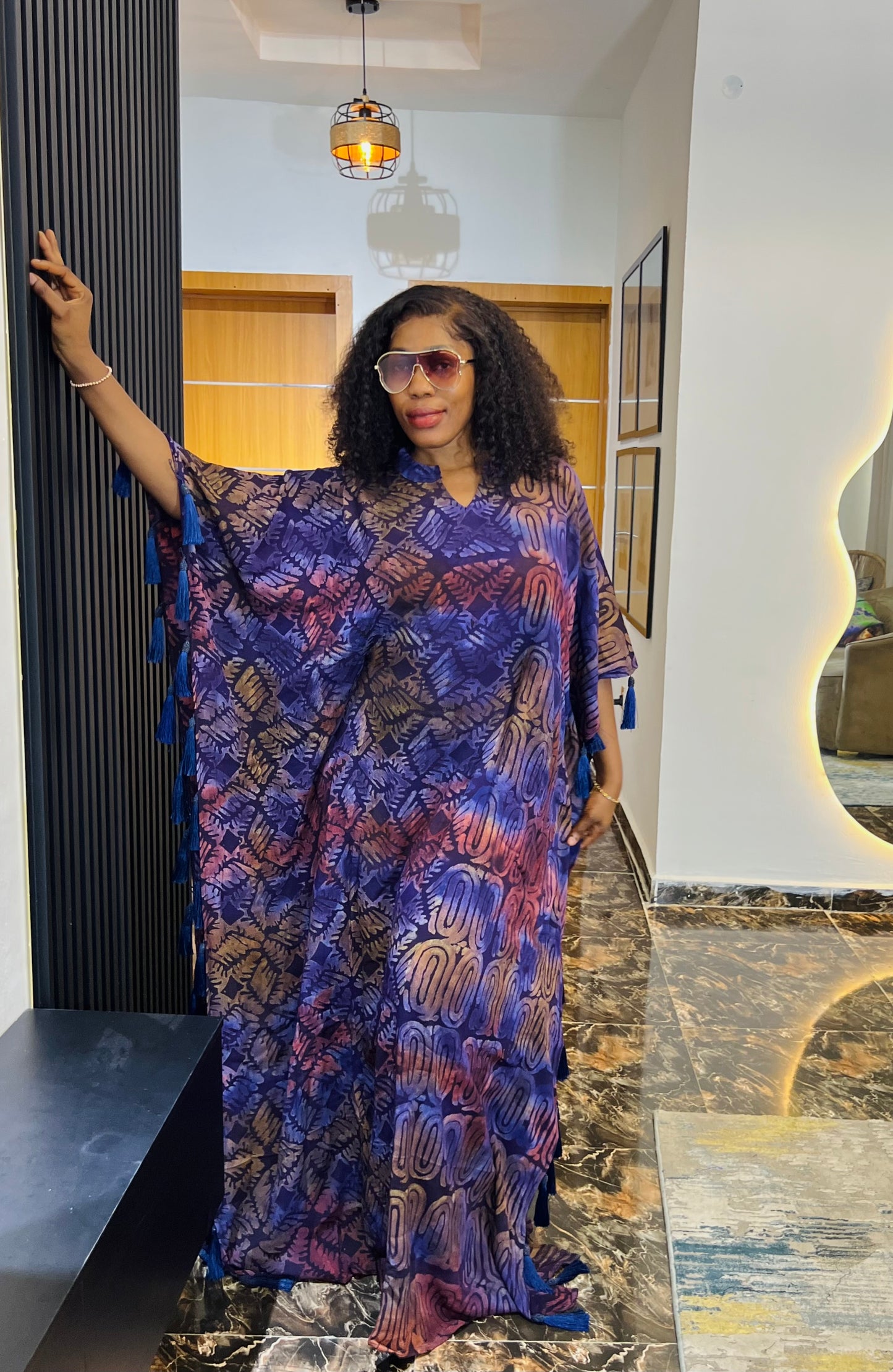 African woman wearing Adire crepe bubu dress – one-size tie-dye kaftan