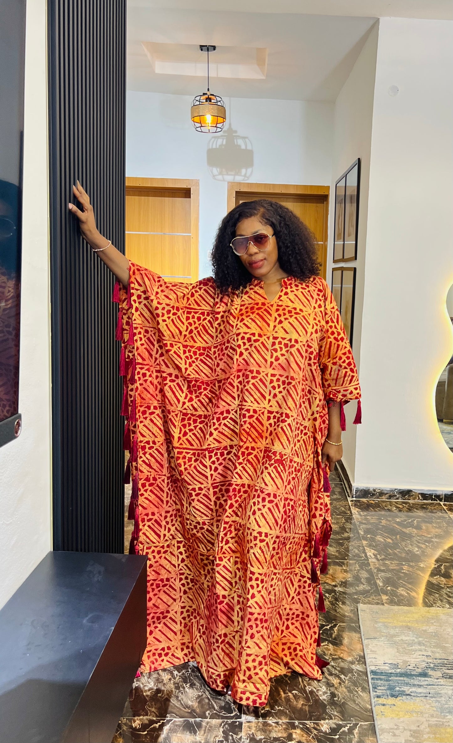 African woman wearing Adire crepe bubu dress – one-size tie-dye kaftan