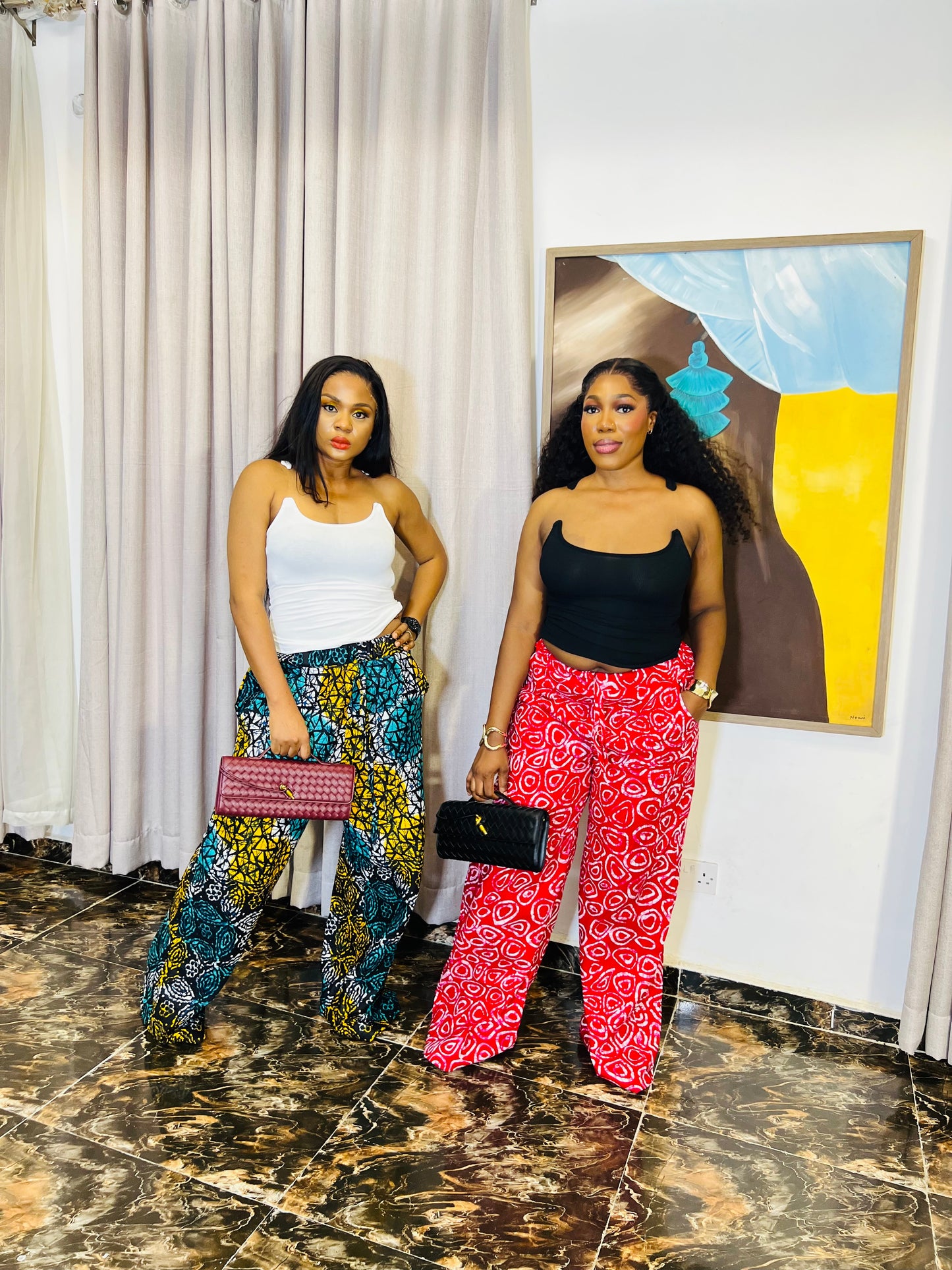 Wide-leg Ankara pants in bold spiral print, styled for soft life days.