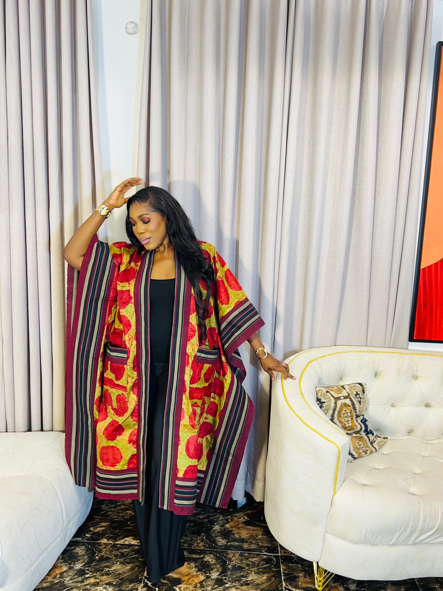 African woman wearing handmade Adire kimono jacket with Aso-Oke trim – one size fits most