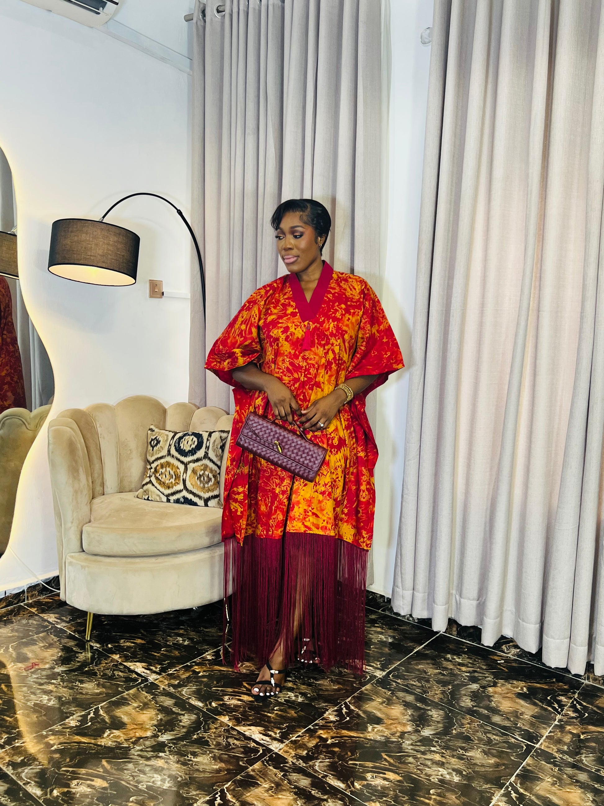 African woman wearing fringe bubu dress – hand-dyed tie-dye kaftan