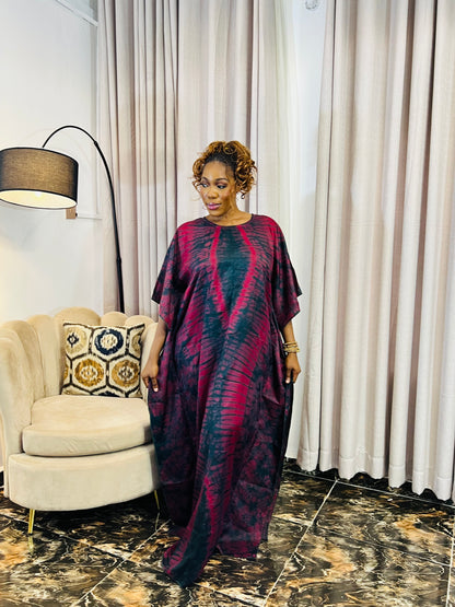 African woman wearing a handmade silk adire boubou dress – full-length traditional kaftan for women