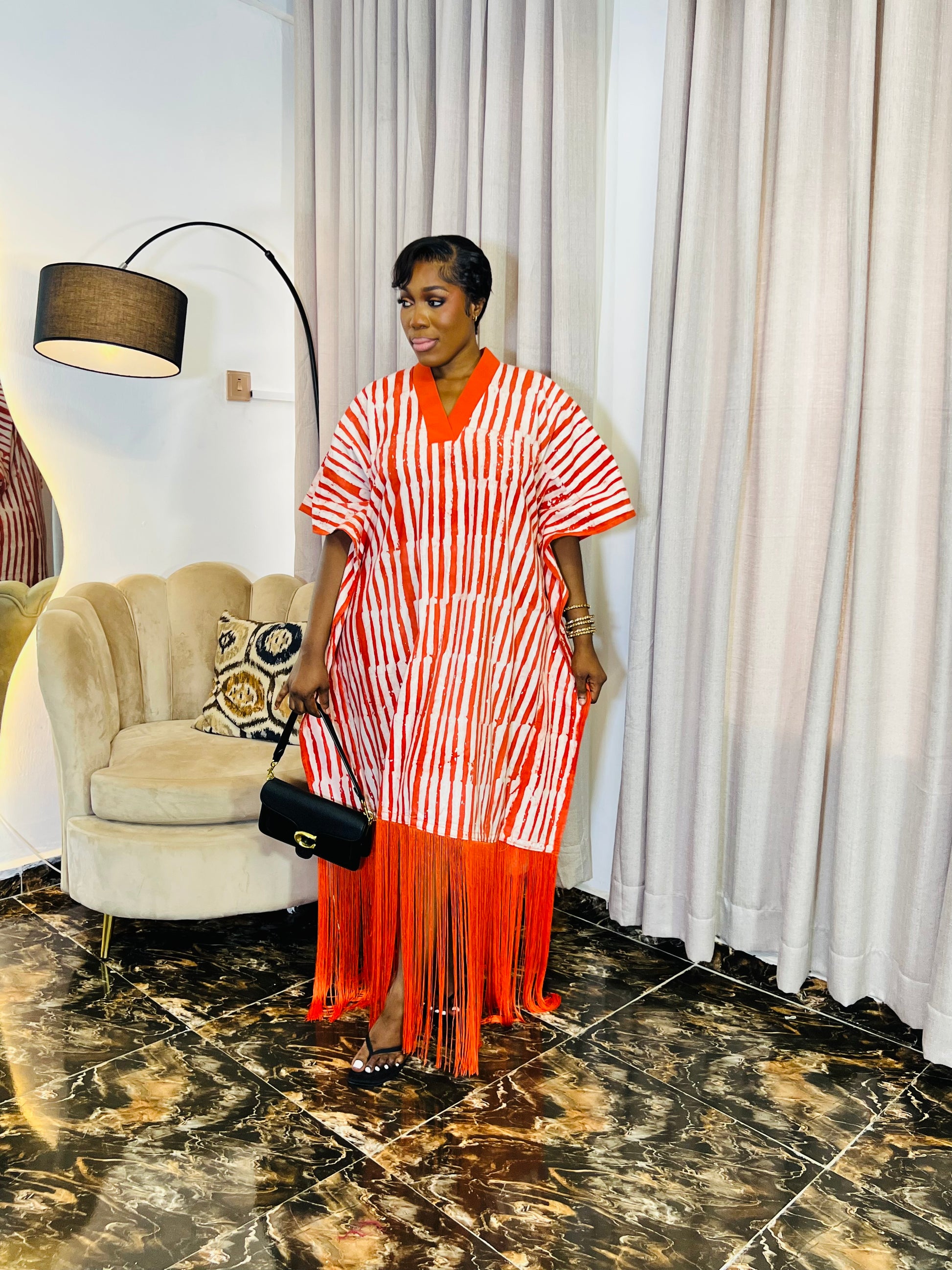 African woman wearing fringe bubu dress – hand-dyed tie-dye kaftan