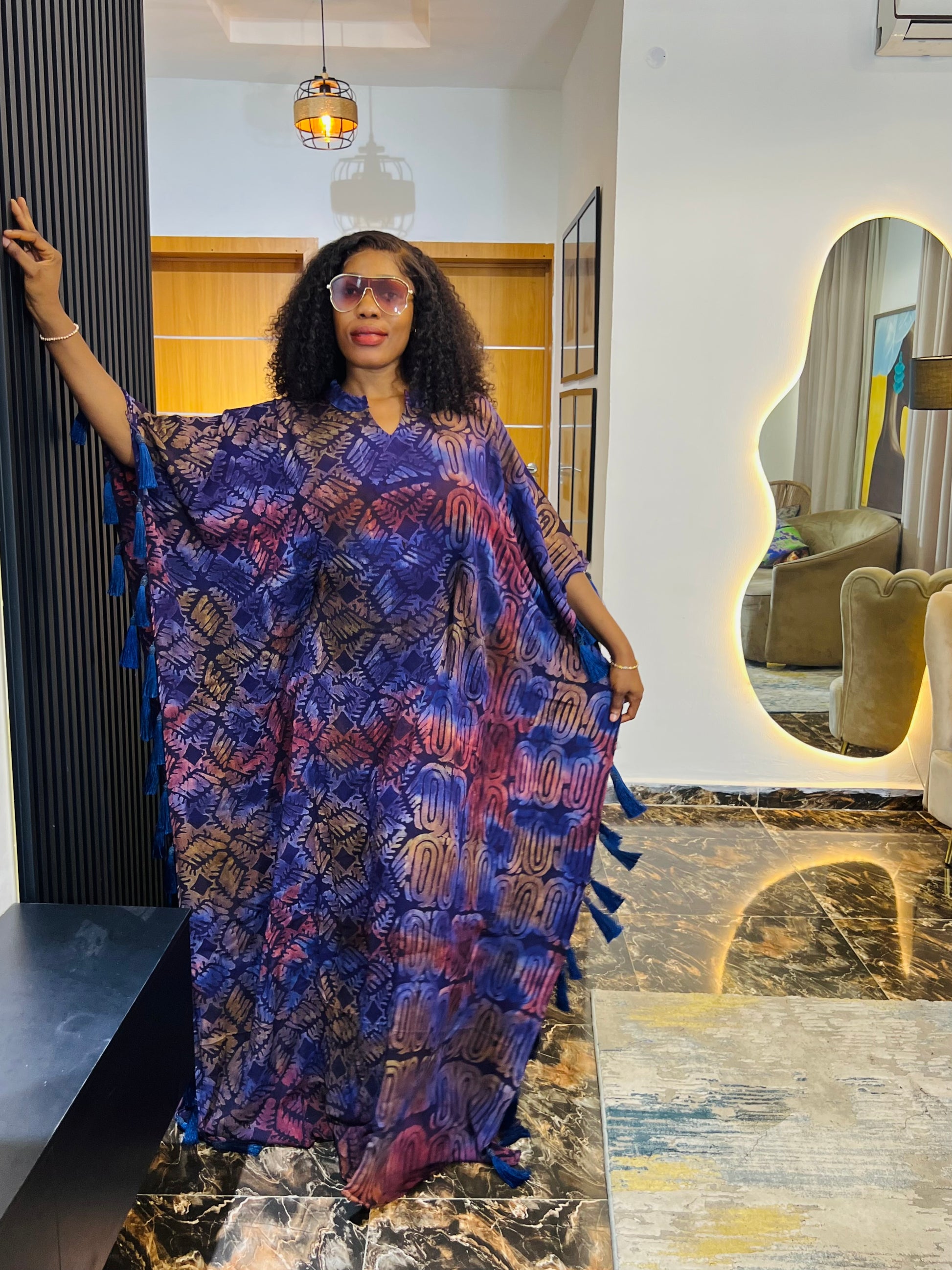 African woman wearing Adire crepe bubu dress – one-size tie-dye kaftan