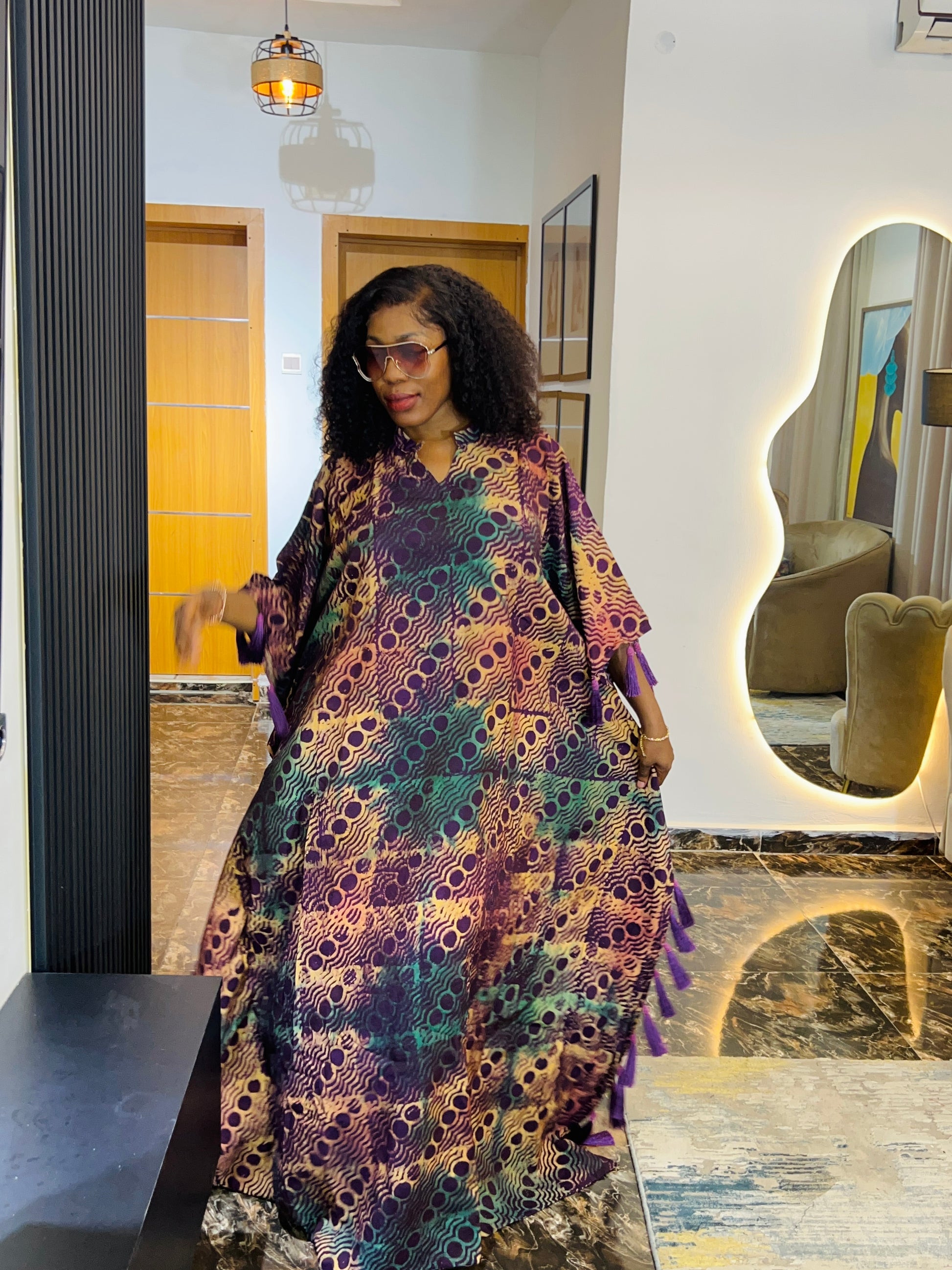 African woman wearing Adire crepe bubu dress – one-size tie-dye kaftan