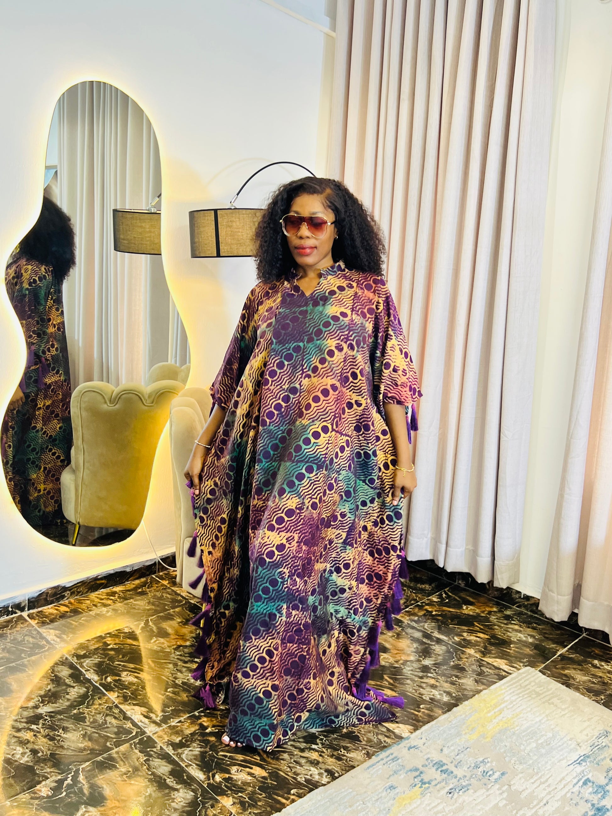African woman wearing Adire crepe bubu dress – one-size tie-dye kaftan