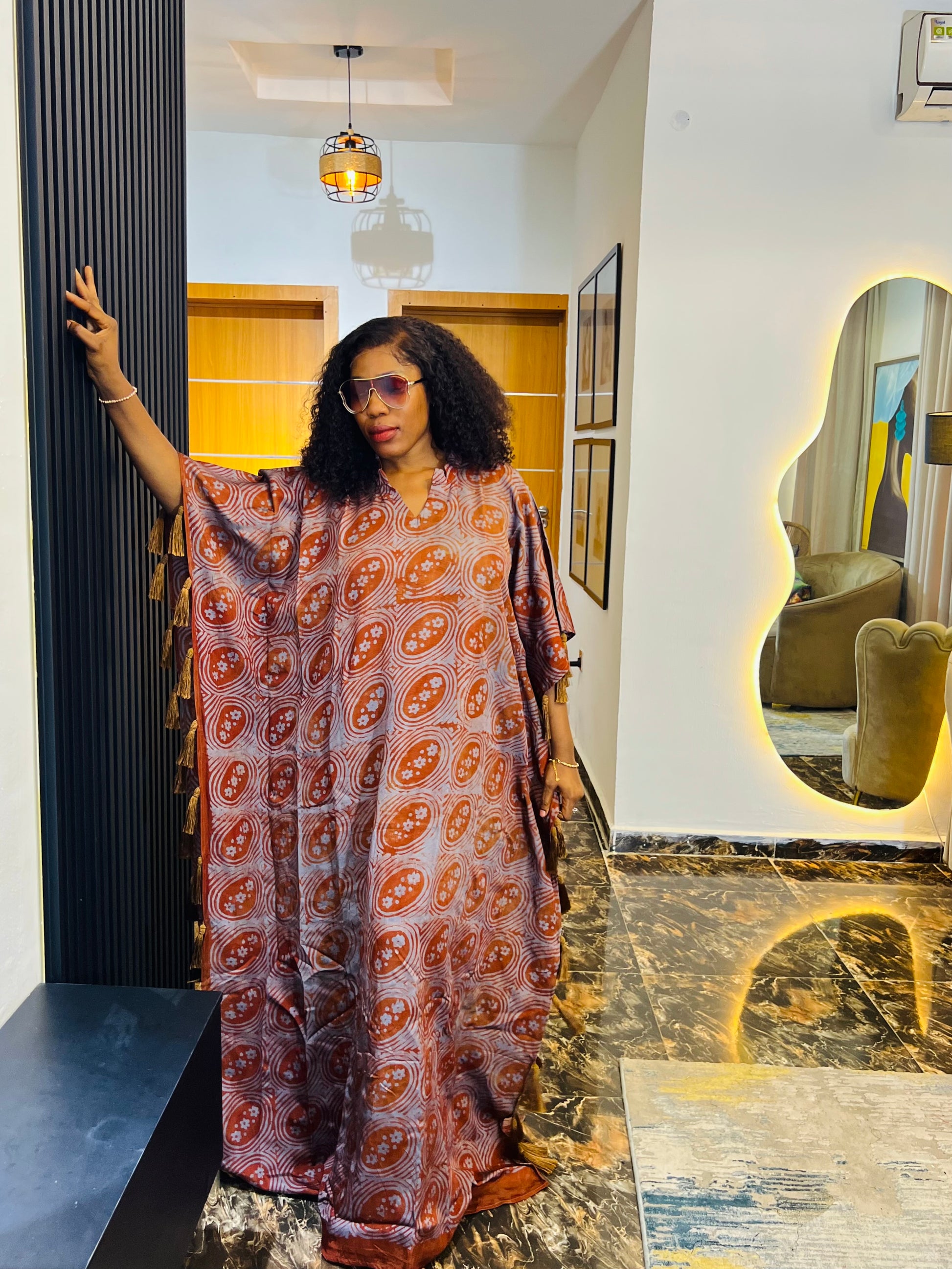 African woman wearing Adire crepe bubu dress – one-size tie-dye kaftan