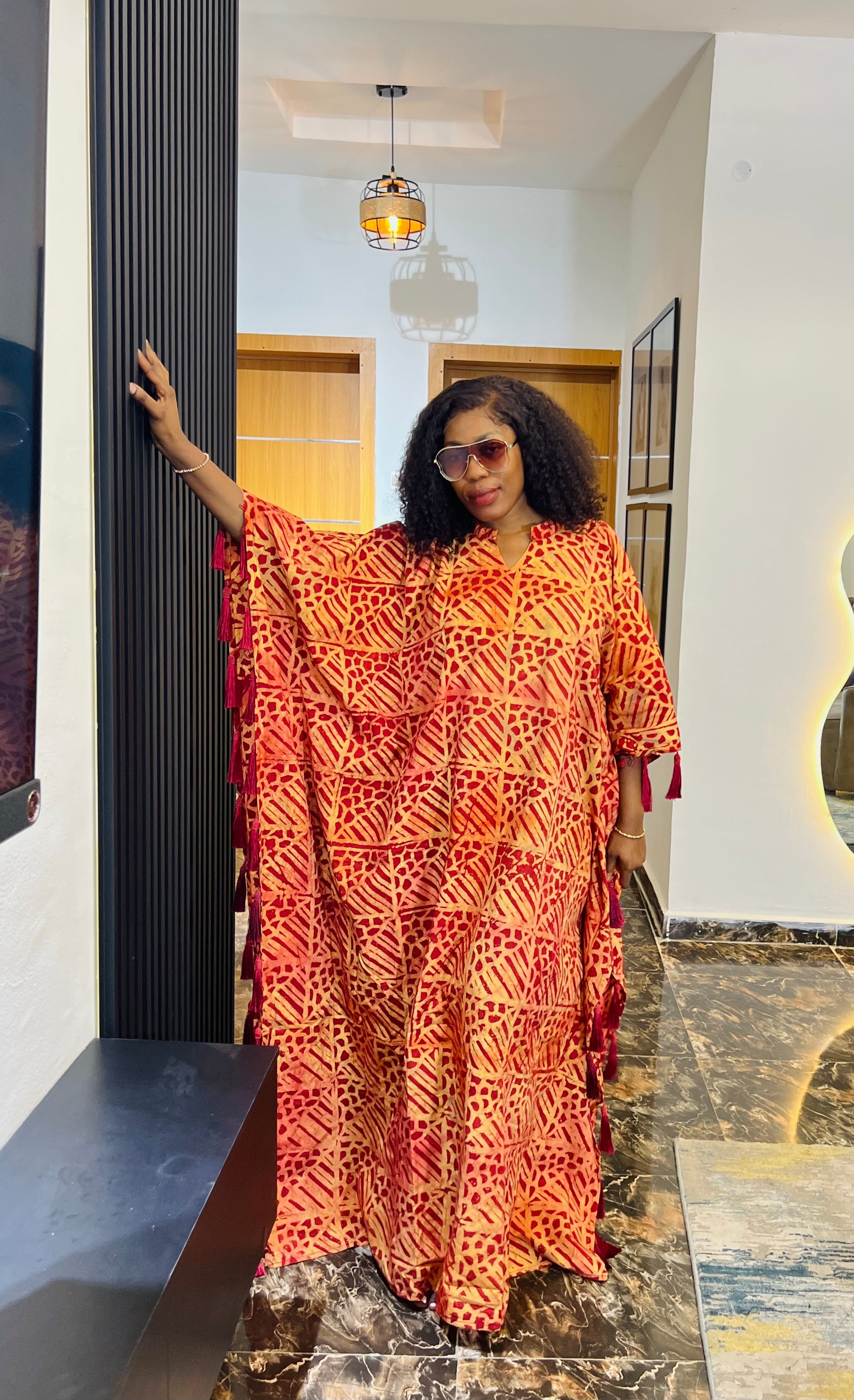 African woman wearing Adire crepe bubu dress – one-size tie-dye kaftan