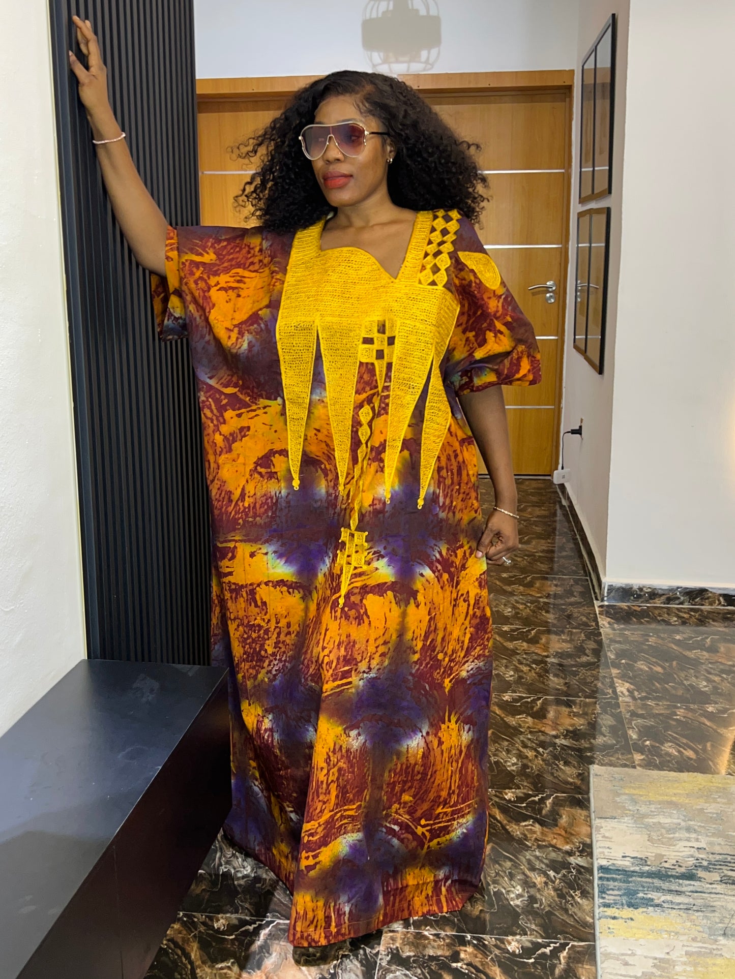 Embroidered Adire dress styled casually for everyday wear
