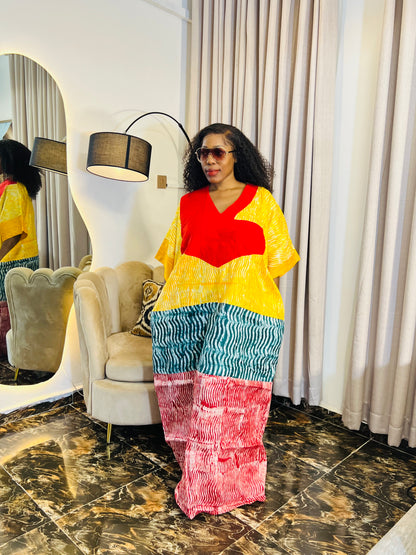 African woman wearing tie-dye bubu dress with Aso-Oke detail