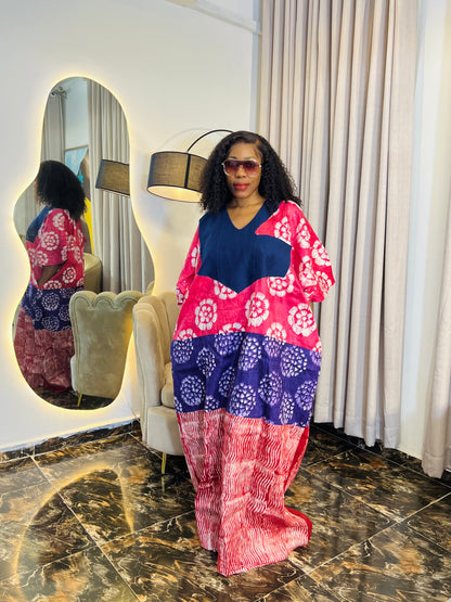 African woman wearing tie-dye bubu dress with Aso-Oke detail