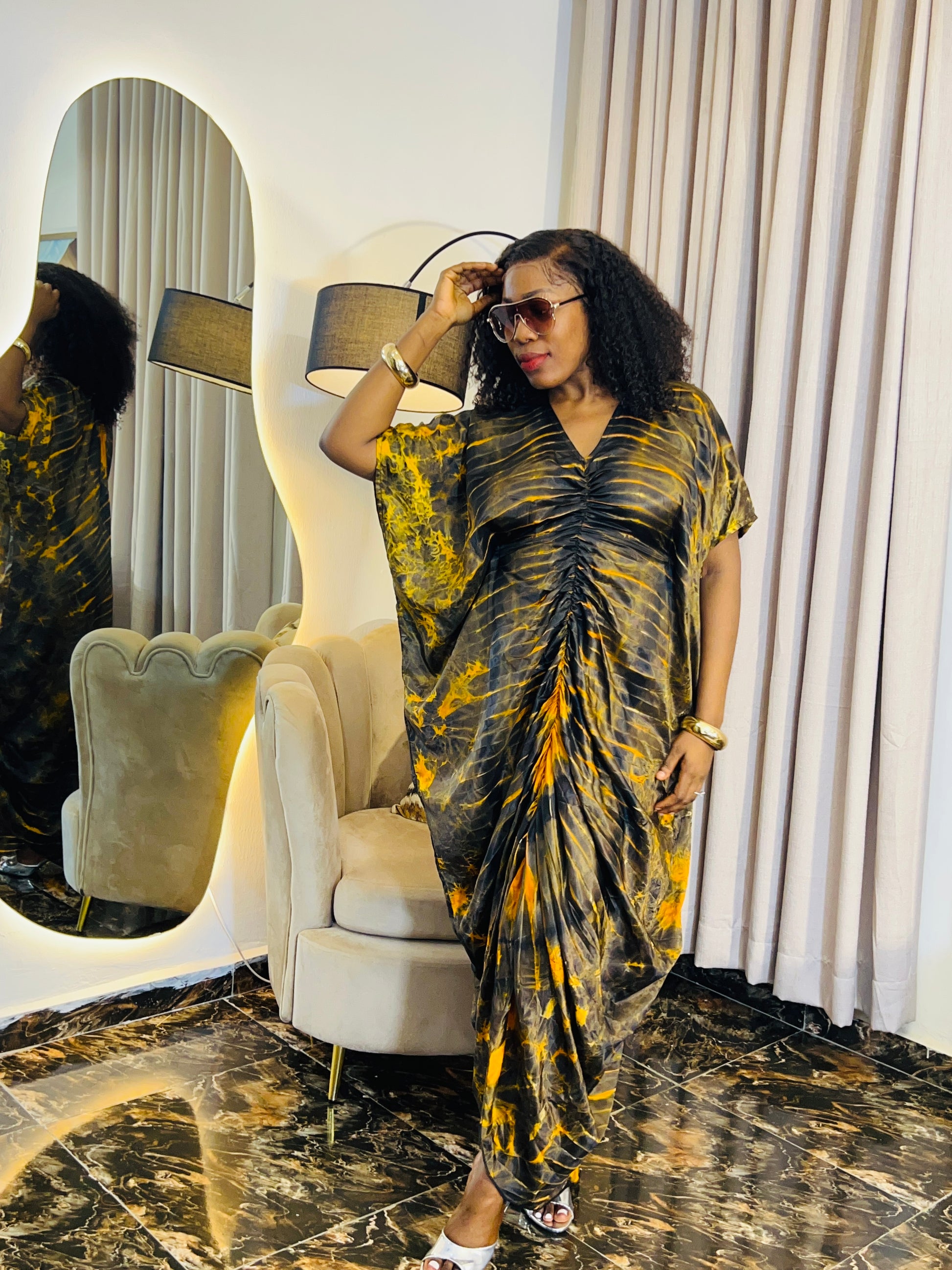 African woman in silk Adire boubou dress with elastic waistband