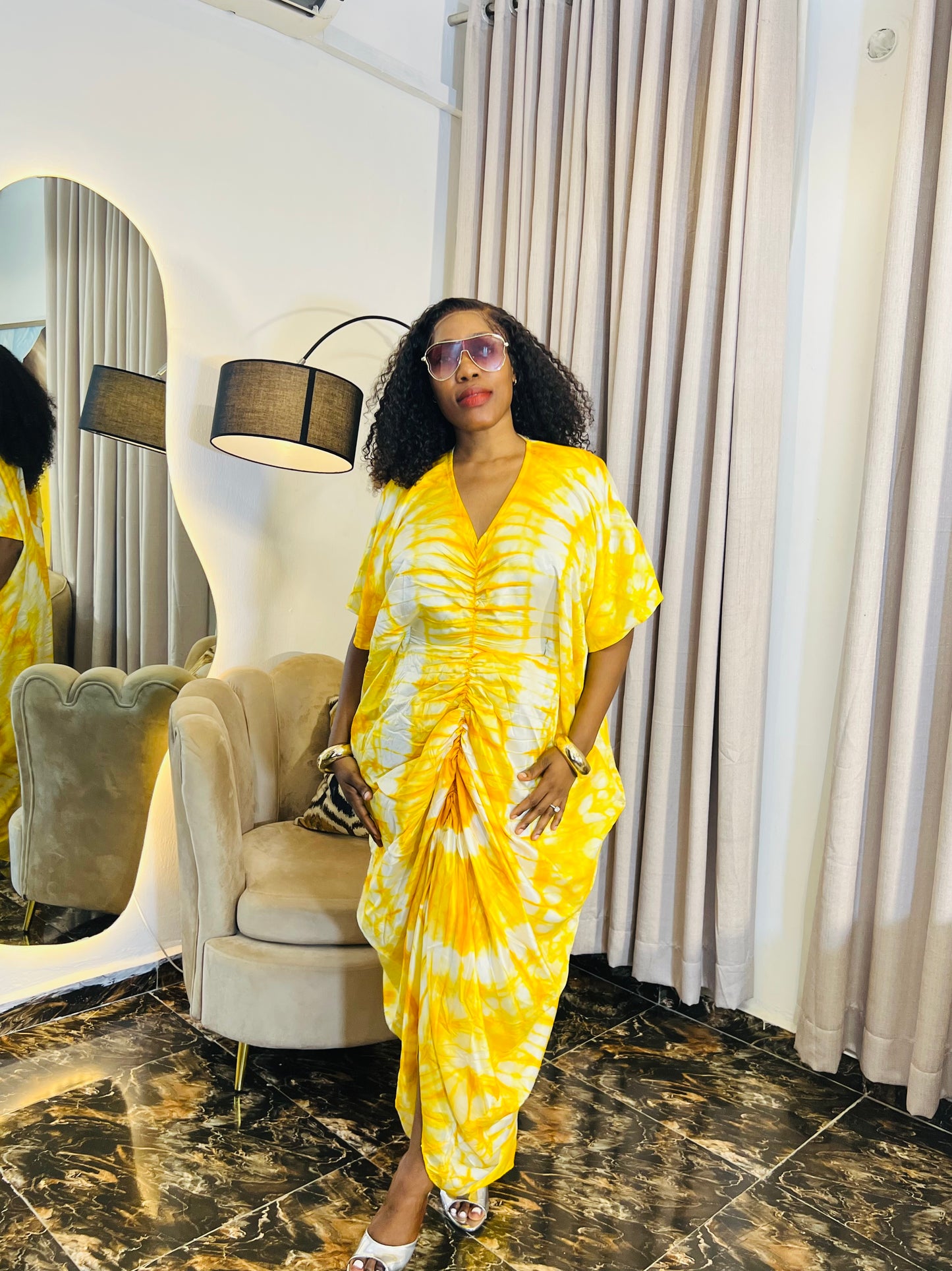 African woman in silk Adire boubou dress with elastic waistband