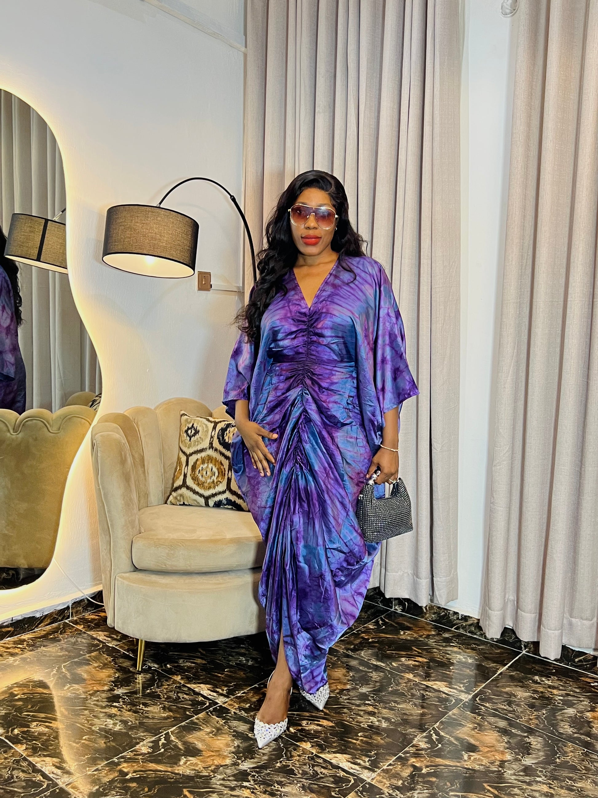 African woman in silk Adire boubou dress with elastic waistband