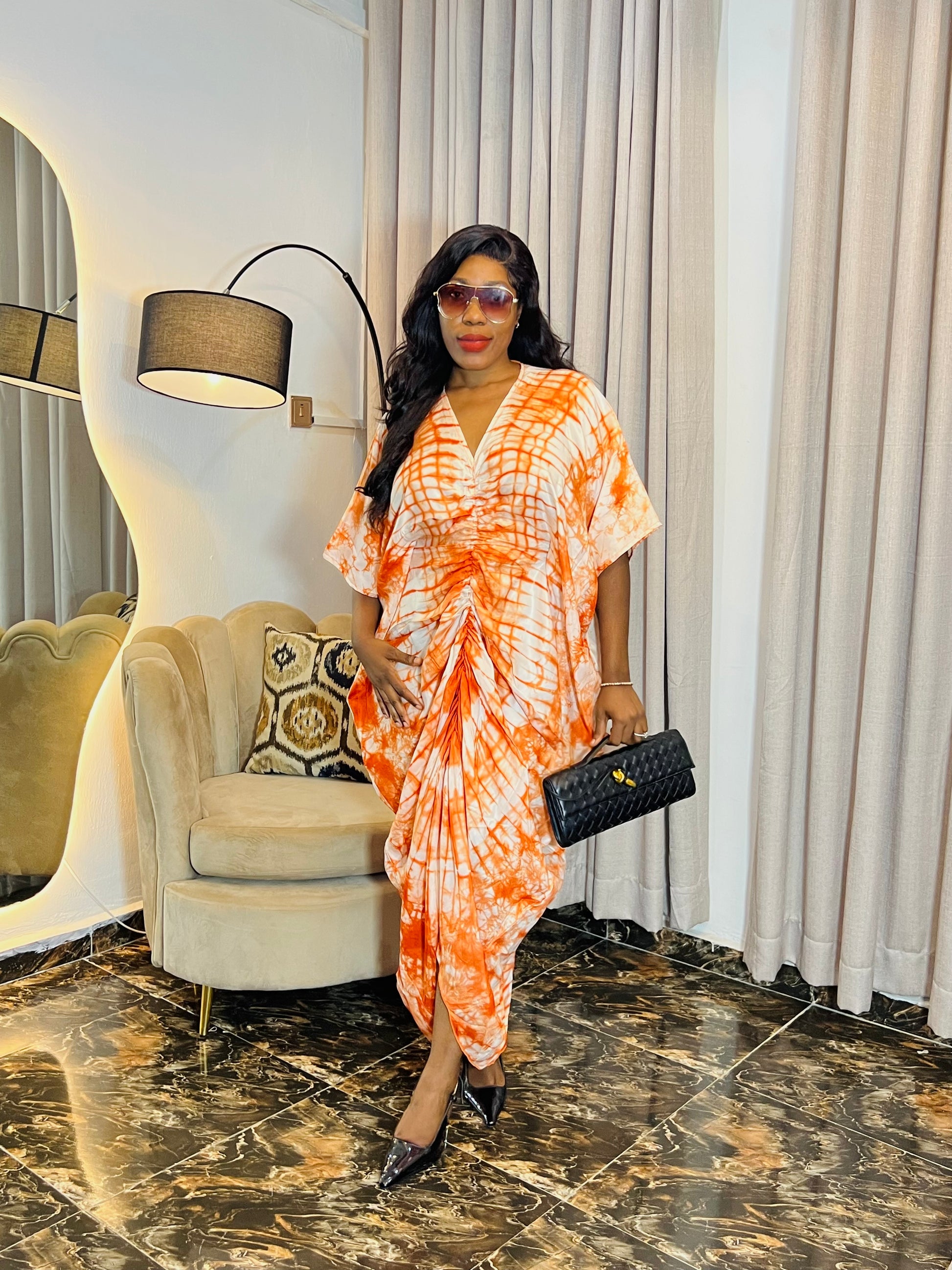 African woman in silk Adire boubou dress with elastic waistband