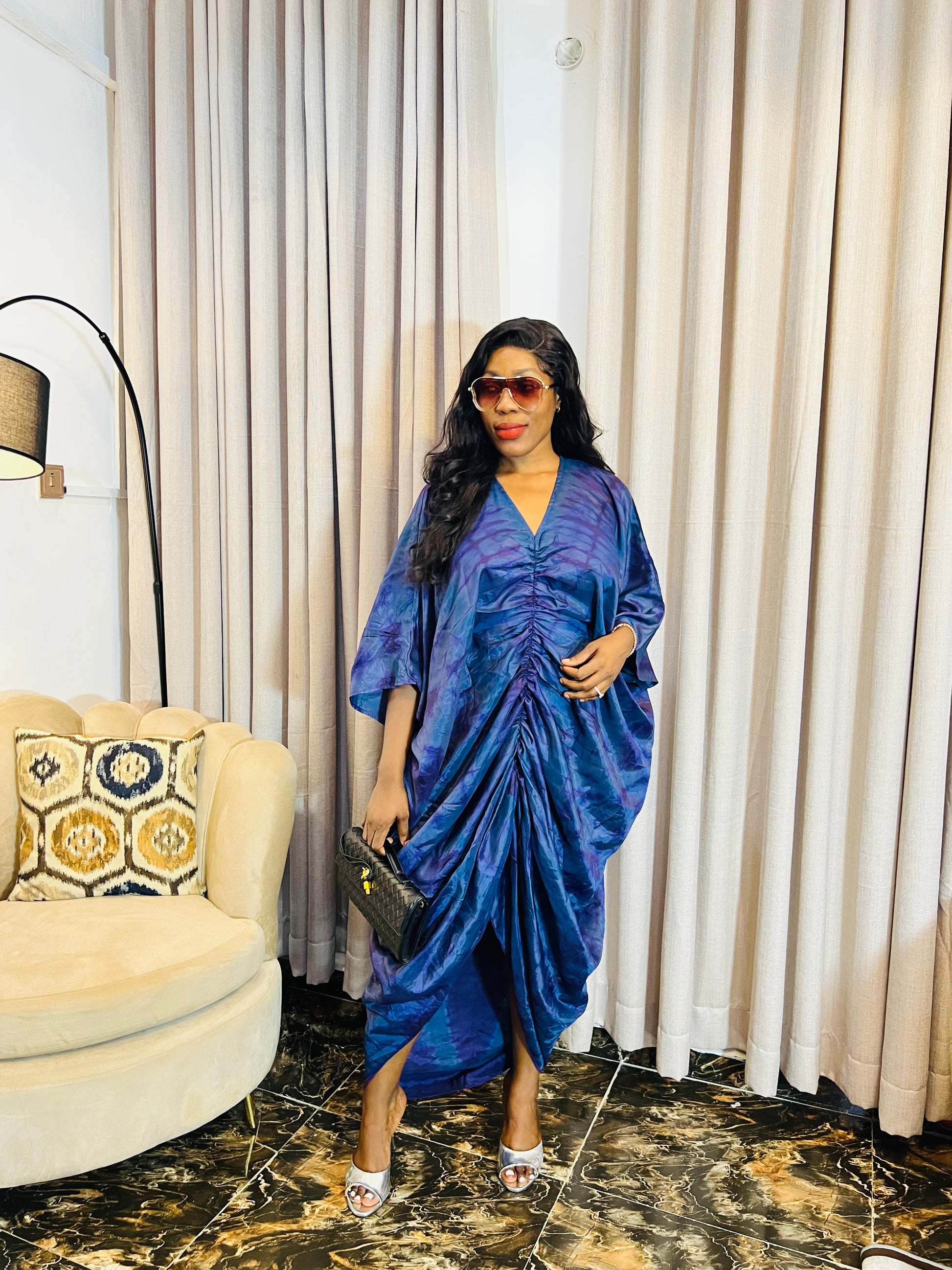 African woman in silk Adire boubou dress with elastic waistband