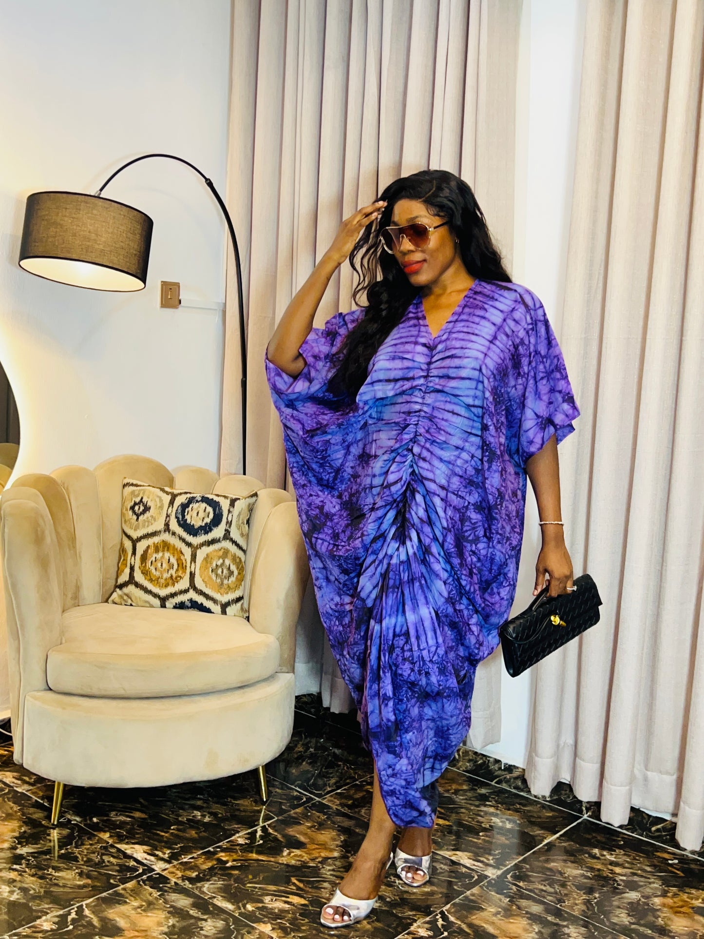 African woman in silk Adire boubou dress with elastic waistband