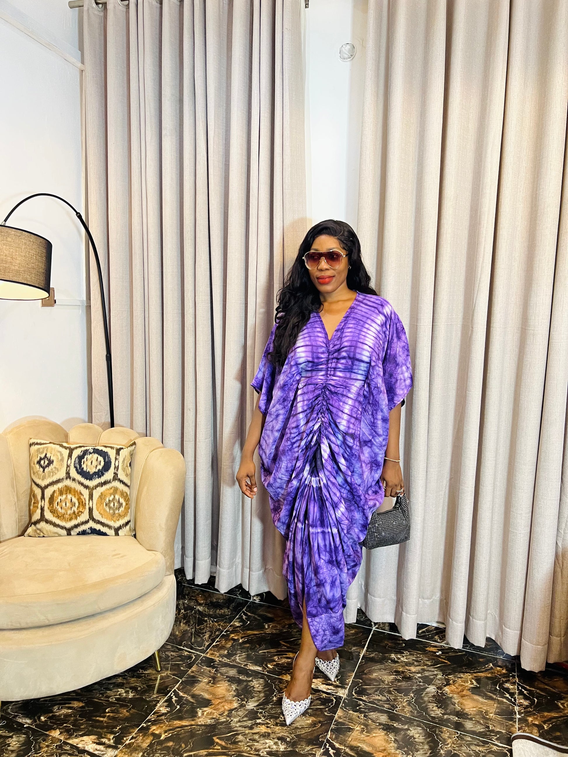 African woman in silk Adire boubou dress with elastic waistband