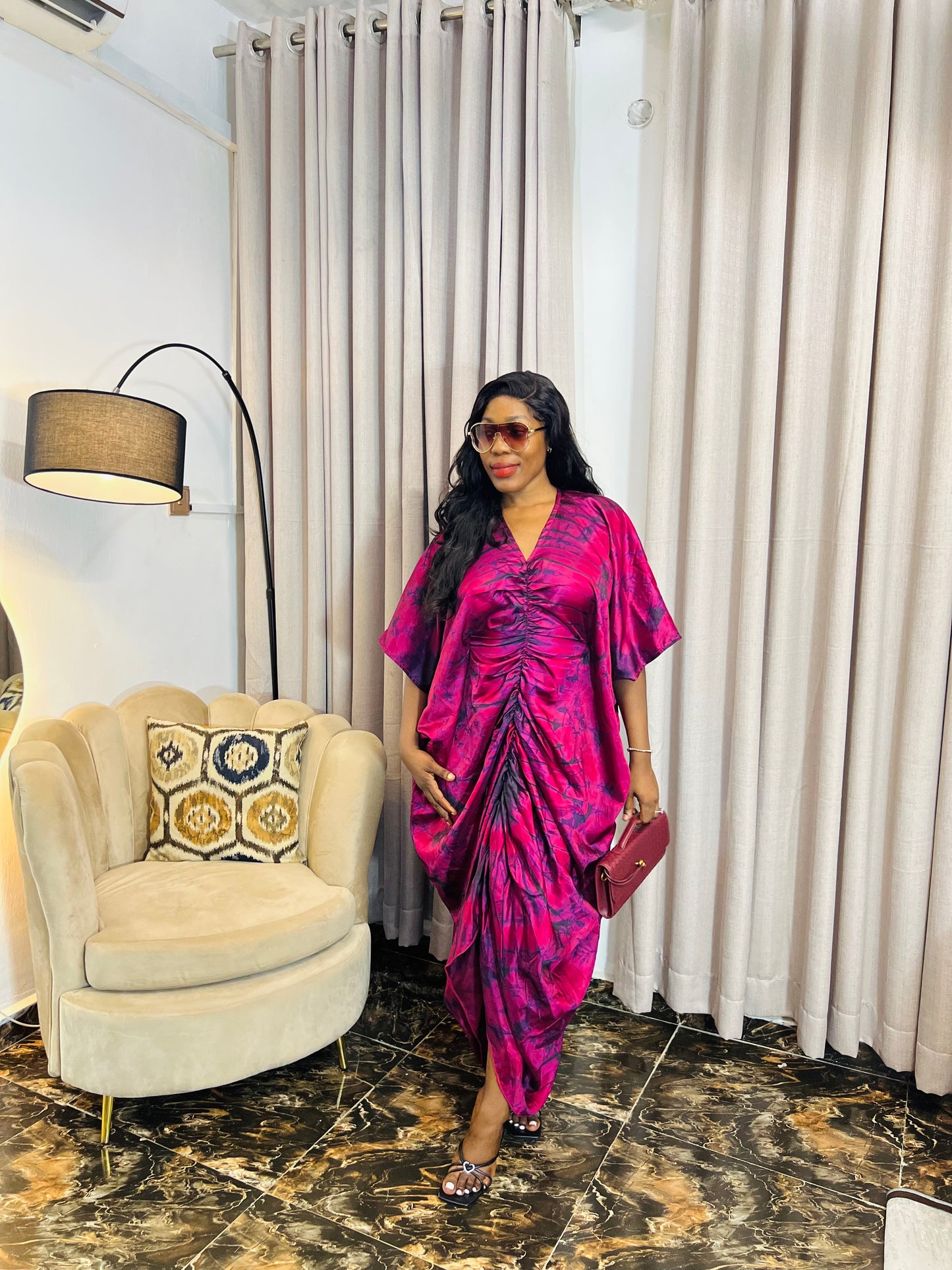 African woman in silk Adire boubou dress with elastic waistband