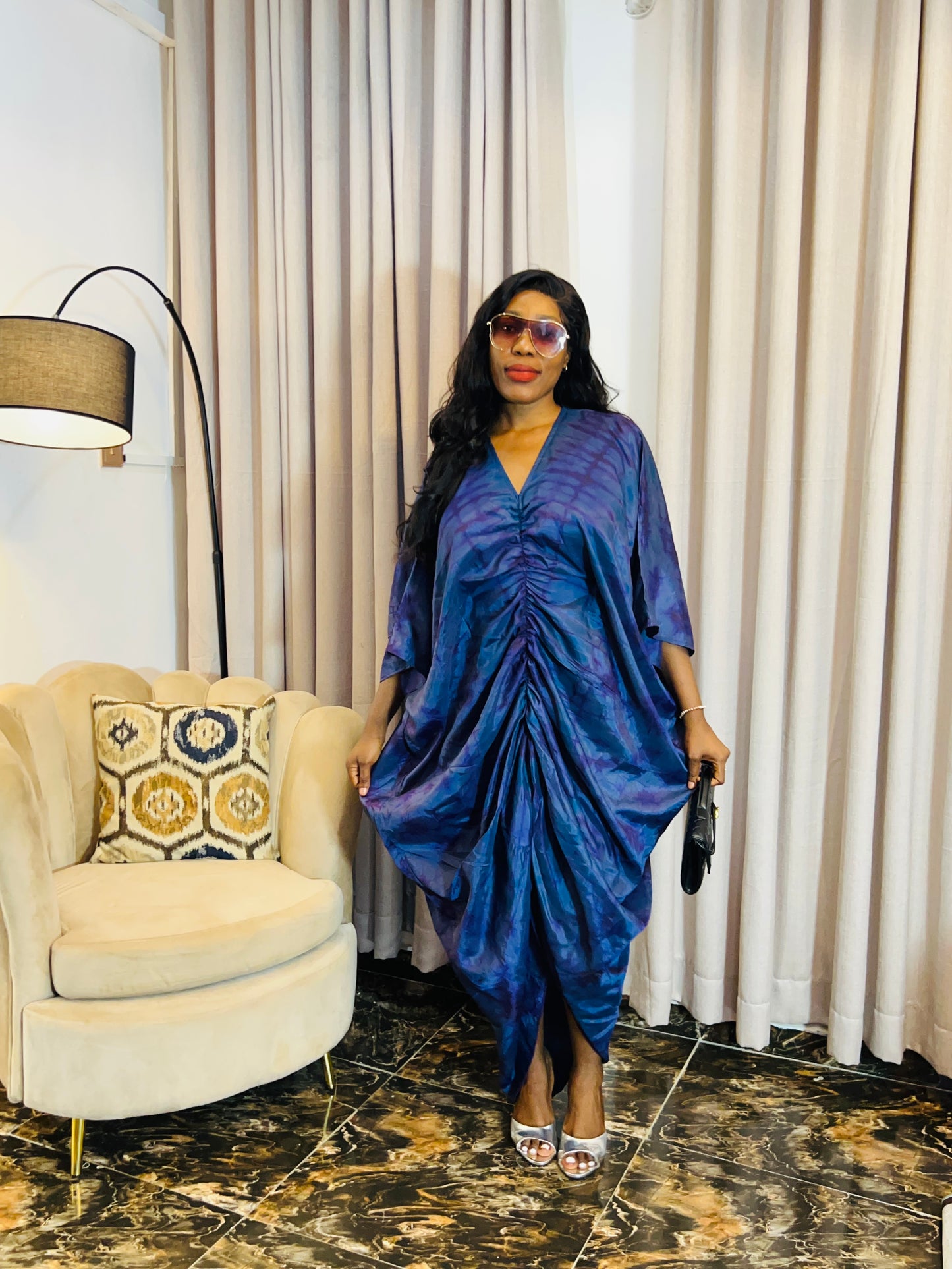 African woman in silk Adire boubou dress with elastic waistband