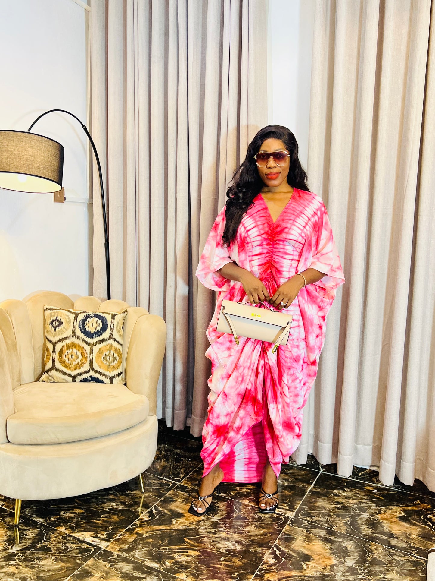 African woman in silk Adire boubou dress with elastic waistband