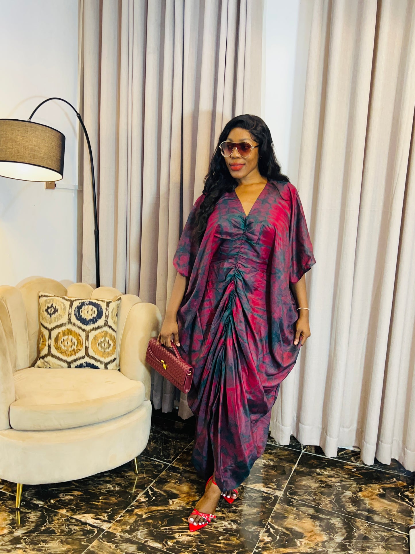 African woman in silk Adire boubou dress with elastic waistband