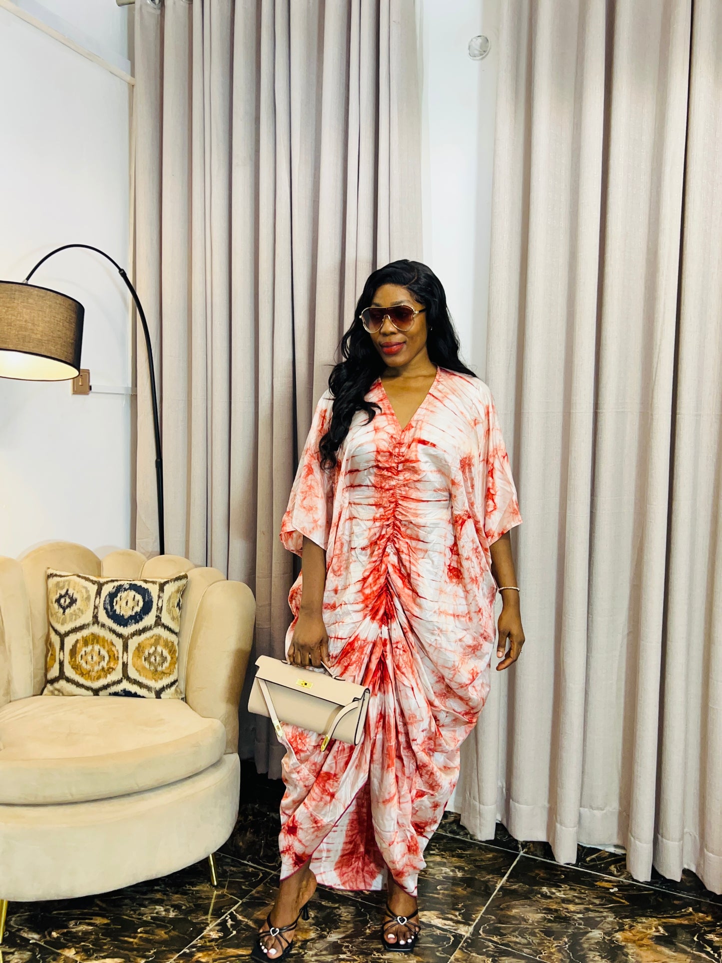 African woman in silk Adire boubou dress with elastic waistband