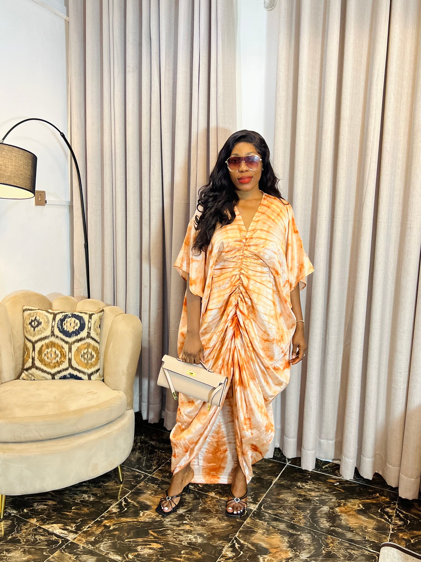 African woman in silk Adire boubou dress with elastic waistband
