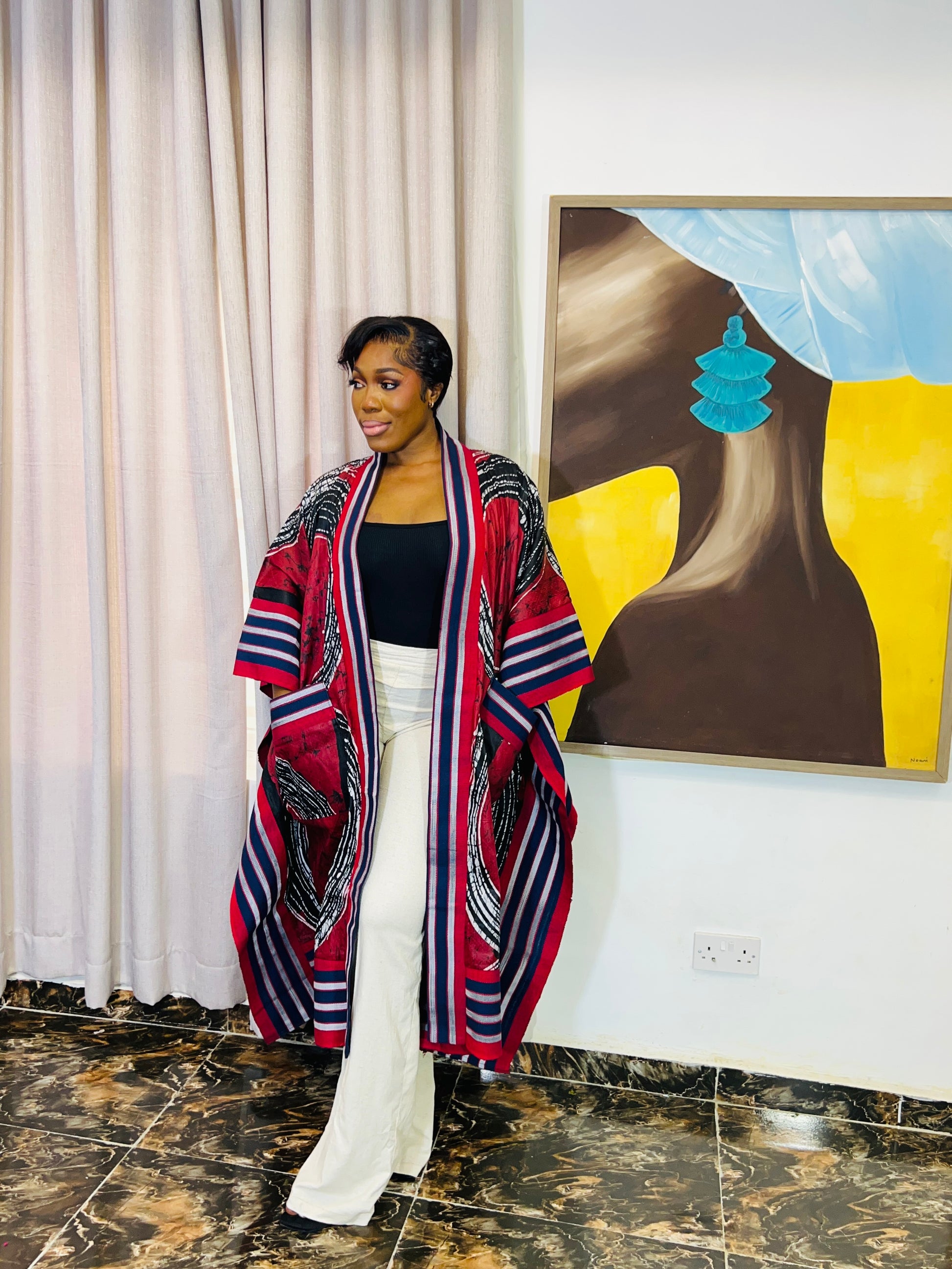 African woman wearing handmade Adire kimono jacket with Aso-Oke trim – one size fits most