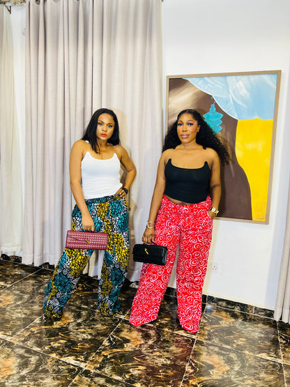 Wide-leg Ankara pants in bold spiral print, styled for soft life days.