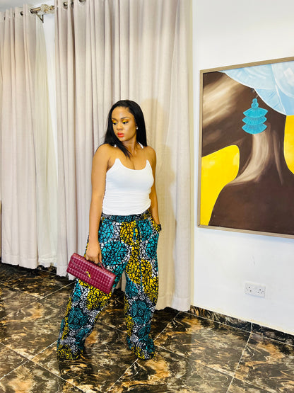 Wide-leg Ankara pants in bold spiral print, styled for soft life days.
