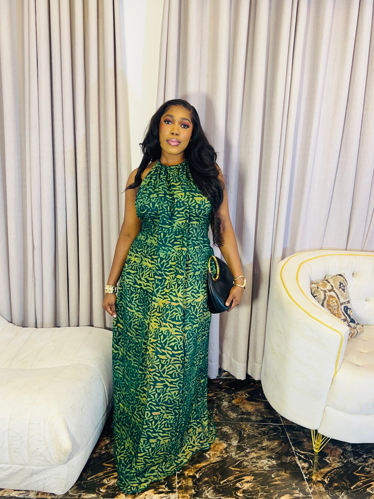 Woman wearing the Layla Adire Boubou in hand-dyed crepe fabric.