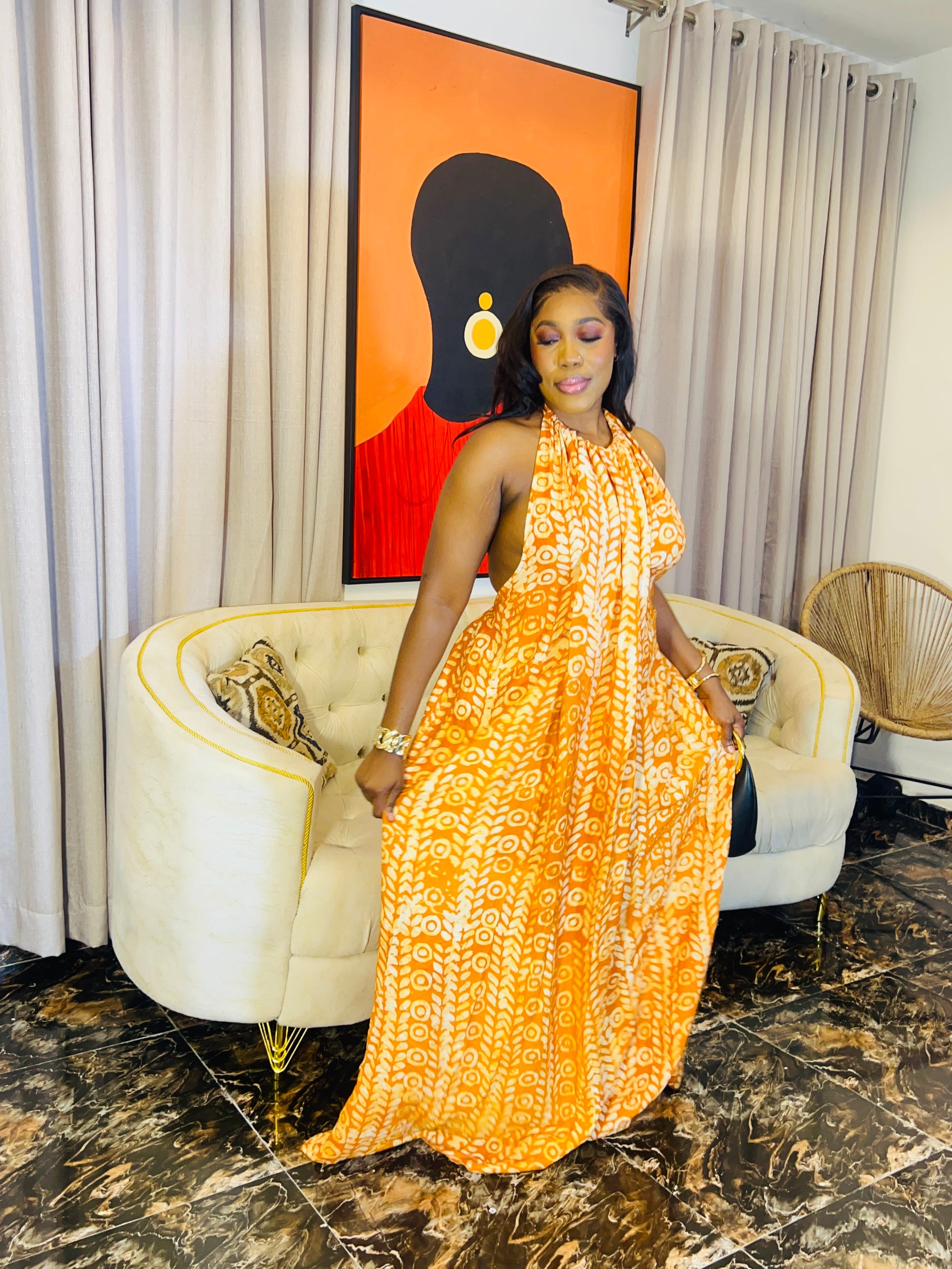 Woman wearing the Layla Adire Boubou in hand-dyed crepe fabric.