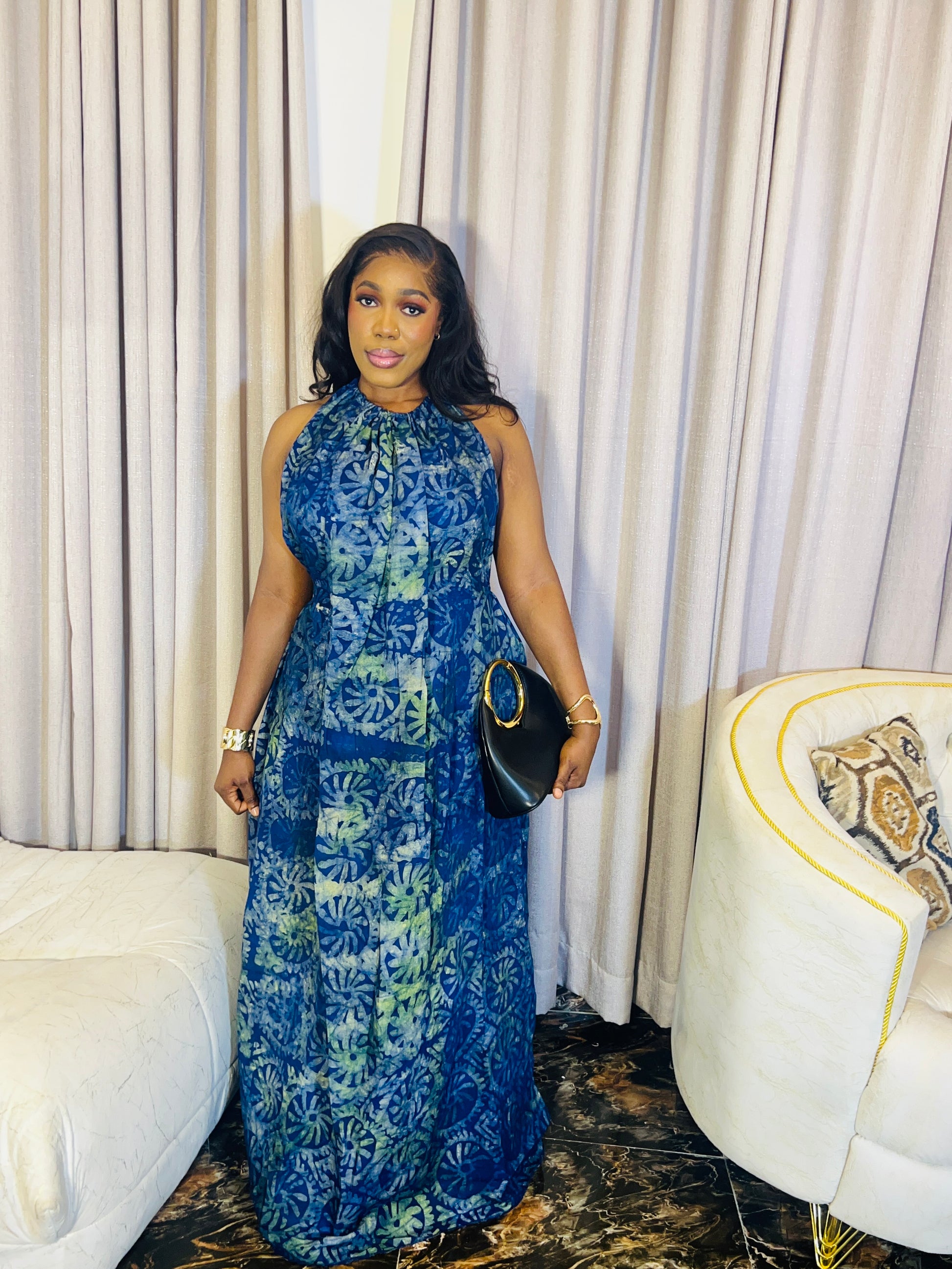 Woman wearing the Layla Adire Boubou in hand-dyed crepe fabric.