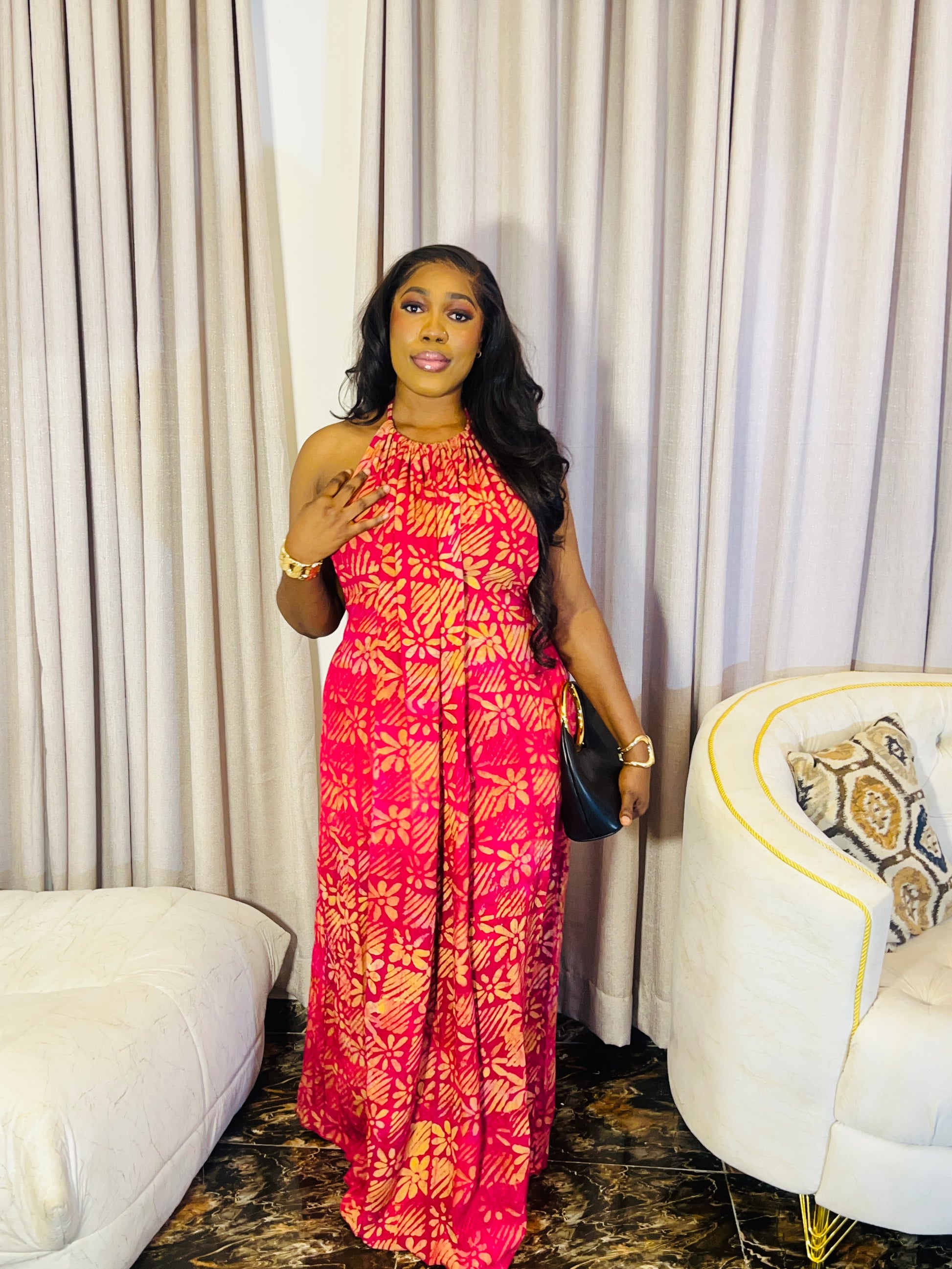 Woman wearing the Layla Adire Boubou in hand-dyed crepe fabric.