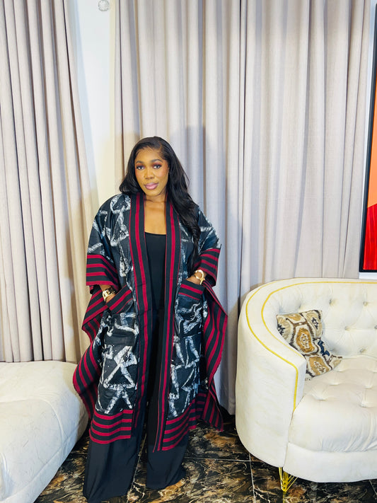African woman wearing handmade Adire kimono jacket with Aso-Oke trim – one size fits most