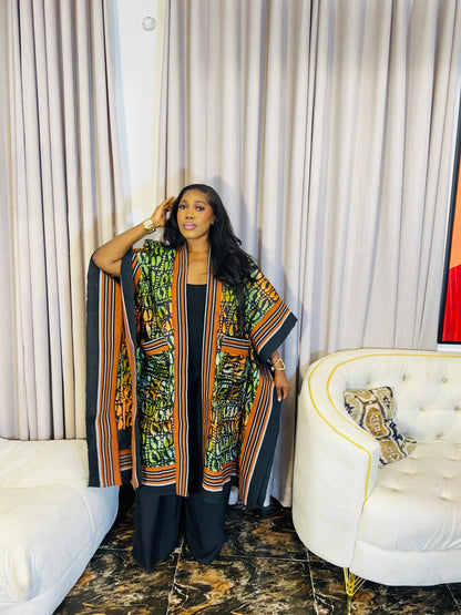 African woman wearing handmade Adire kimono jacket with Aso-Oke trim – one size fits most