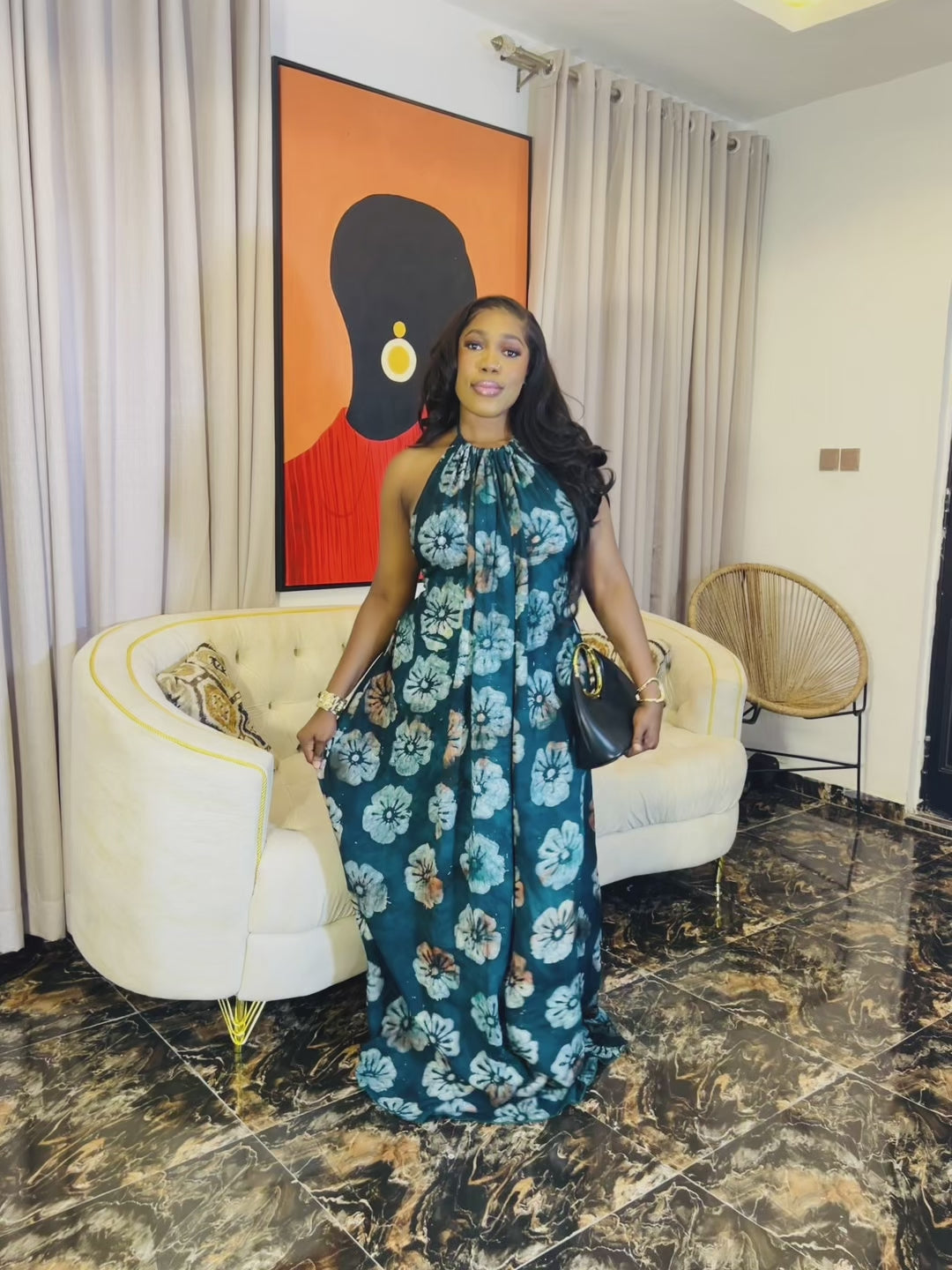 Woman wearing the Layla Adire Boubou in hand-dyed crepe fabric.